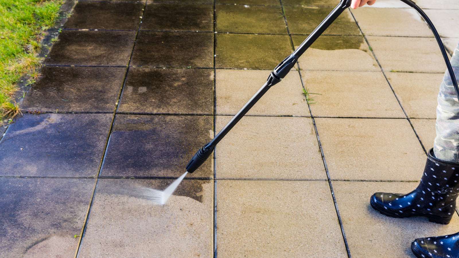 The man Is using Pressure Washing